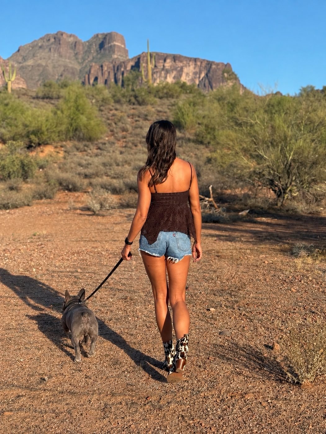Jen walking her French Bulldog Tula toward the Superstition Mountains near Queen Creek AZ